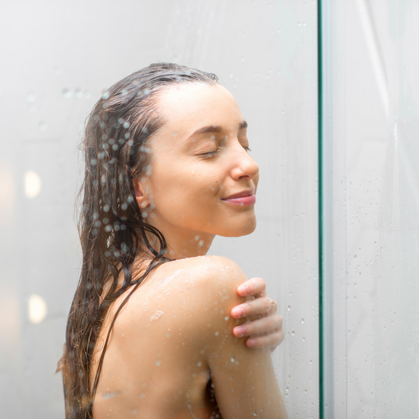 woman in a shower with a shower steamer