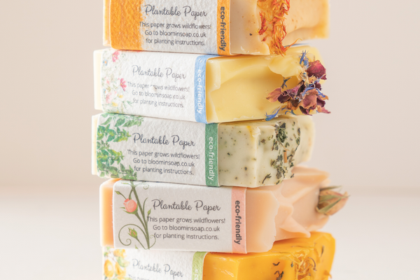 a stack of natural soap bars with plantable labels