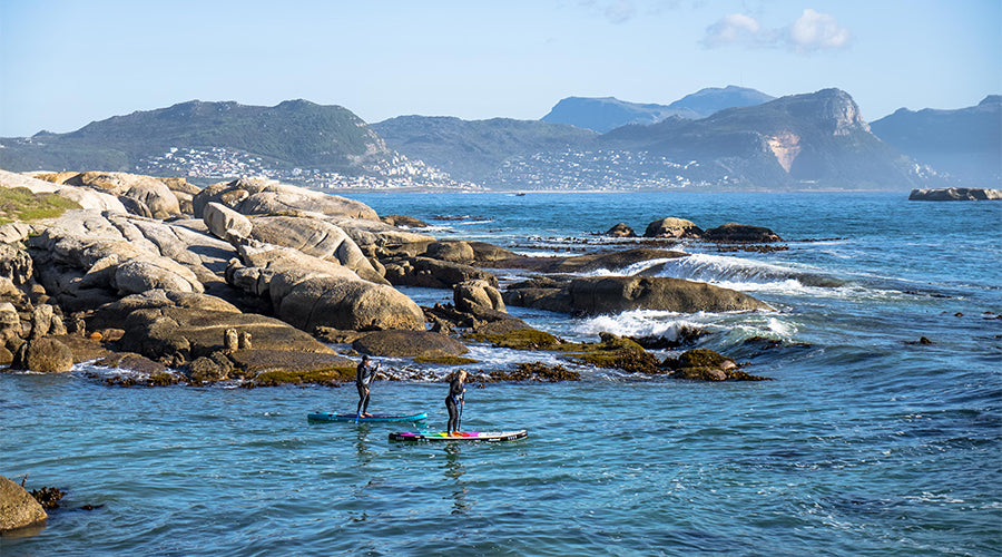 people paddling out to sea