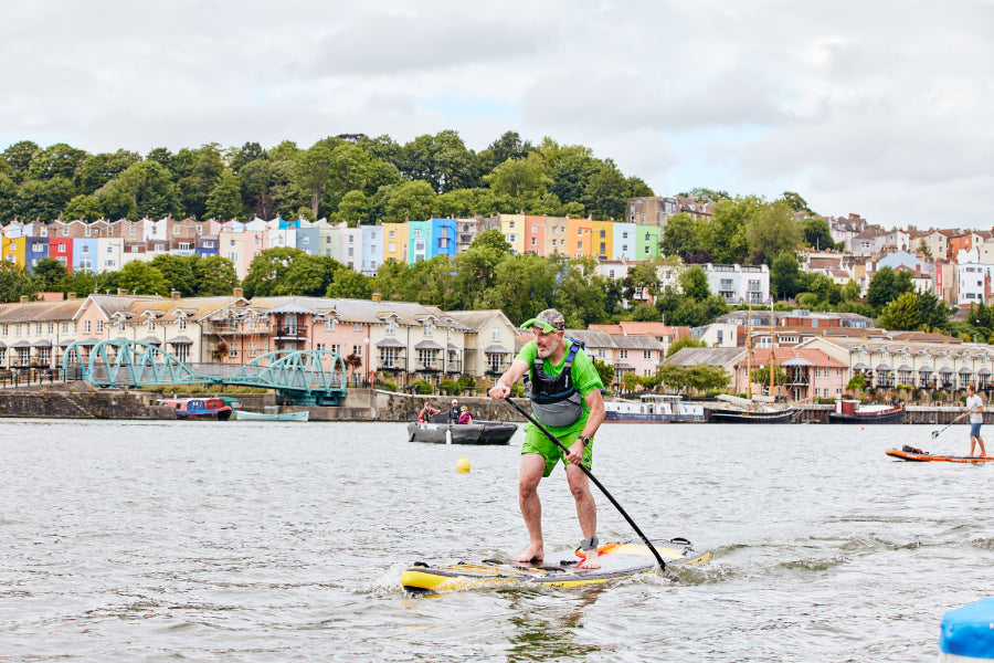 Man on an Aquaplanet Stinger wearing a green costume