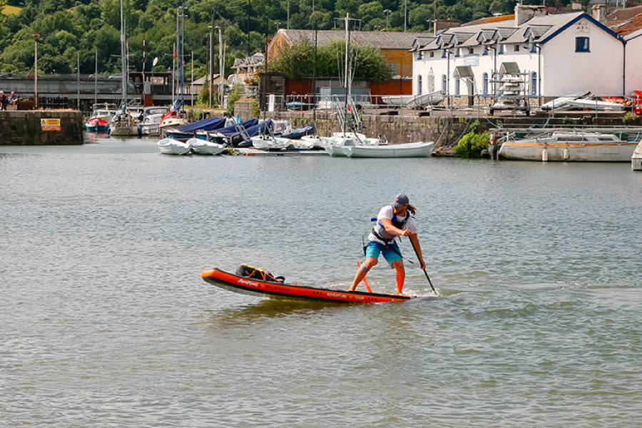A person on an Aquaplanet Wilderness paddle board.