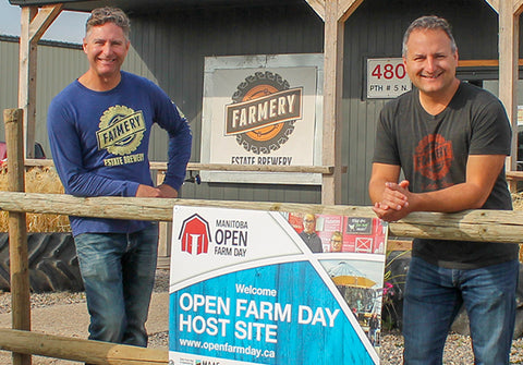 Farmery at Open Farm day standing on porch ready to give tours