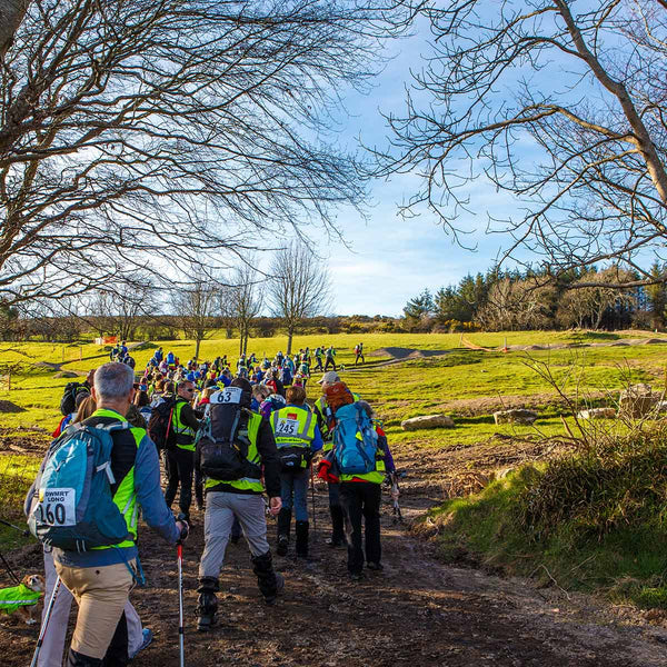 A group of guided walkers start out on the route of the DWMRT Walk The Line event in 2023