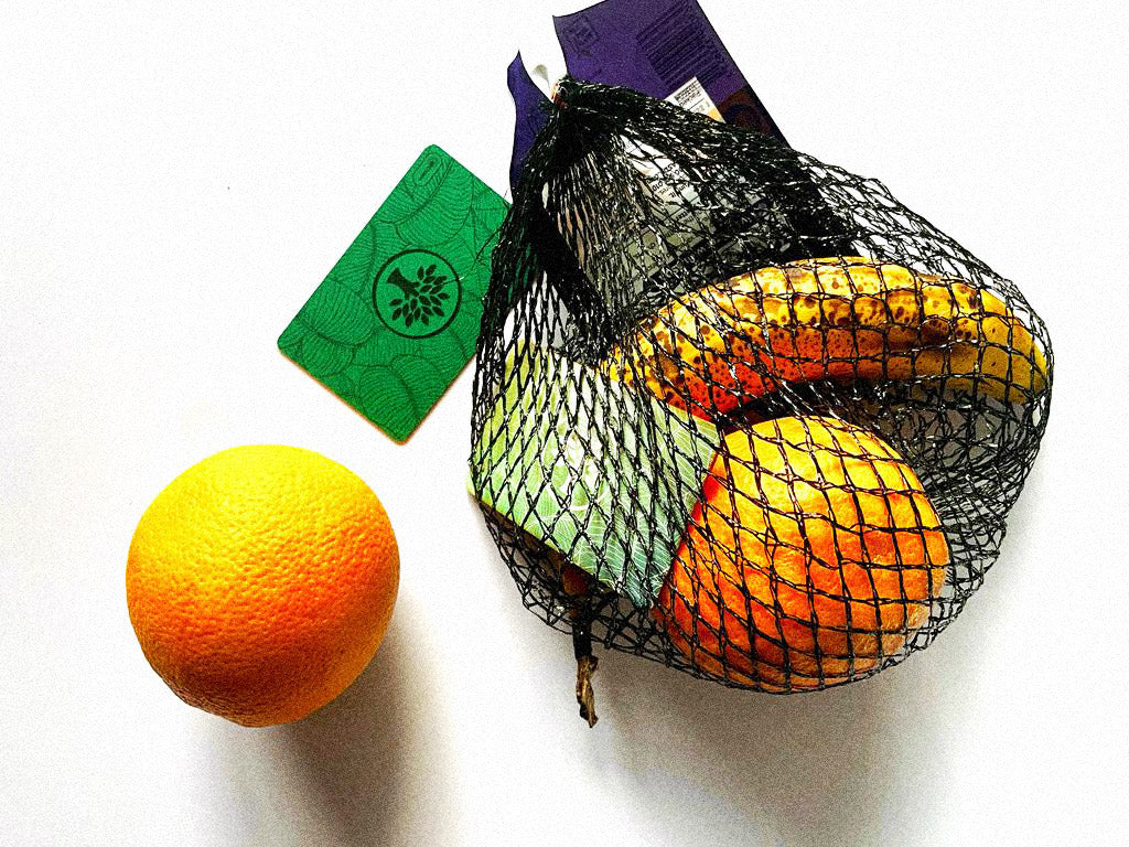 Orange and a Green Wooden Digital Card with a fruit net banana and an orange