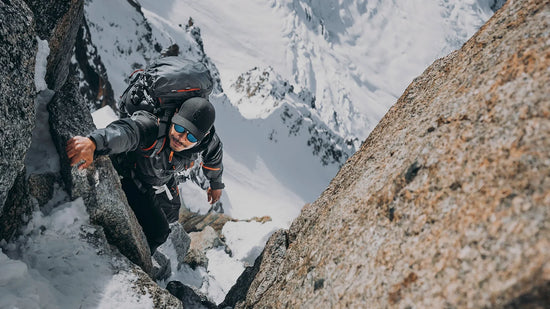 Nimsdai climbing in the alps wearing the K2 Winter Waterproof Jacket