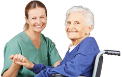 nurse holding hand of elderly woman in wheelchair, smiling