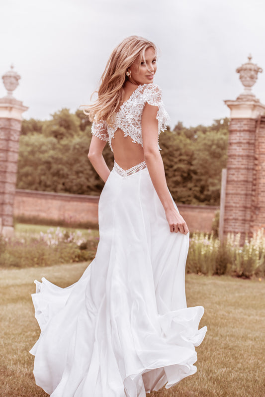 A romantic chiffon A-line wedding dress with long blouson sleeves and  delicate lace edging. – Kelsey Rose