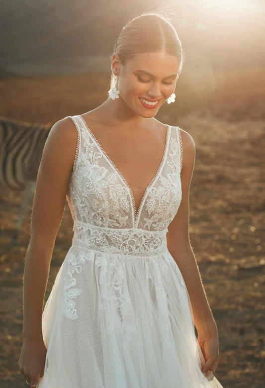 A romantic soft tulle and lace wedding dress. Perfect for an