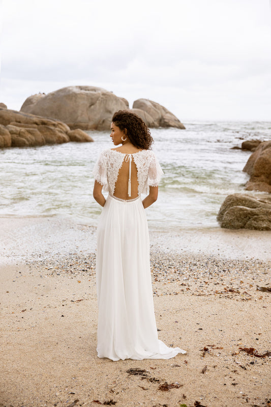 A romantic chiffon A-line wedding dress with long blouson sleeves