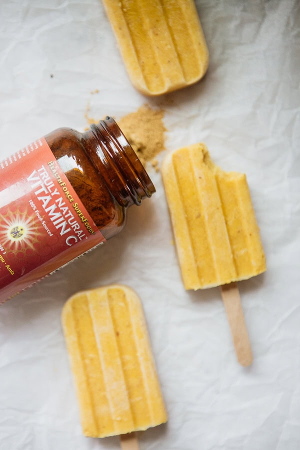 Orange Creamsicle Popsicles And A Bottle Of Truly Natural Vitamin C Powder