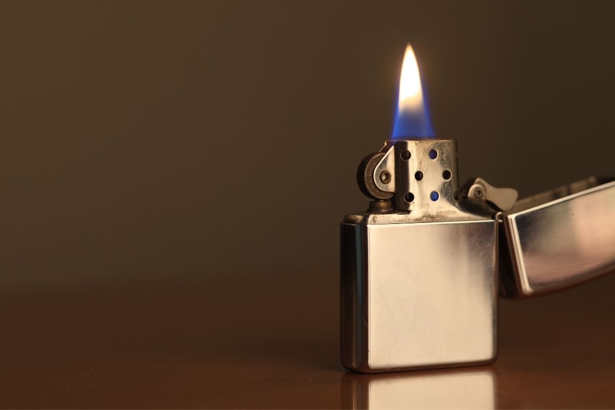 silver lighter with flame