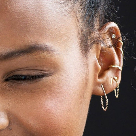 Zoe Kravitz with a helix piercing on her ear.