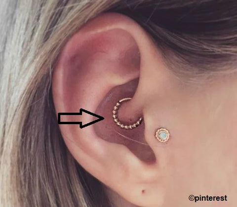woman showing off her stylish Daith piercing