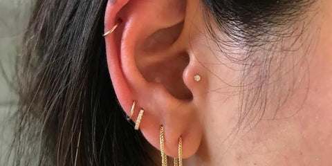 Woman with tragus ear piercing