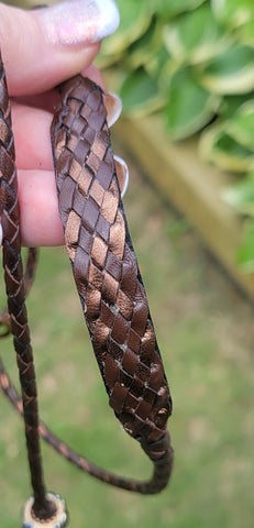 A brown and bronze flat braided kindness collar