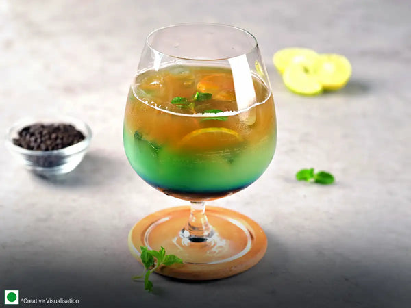 A glass of chilled Hawaiian Blue Iced Tea mocktail