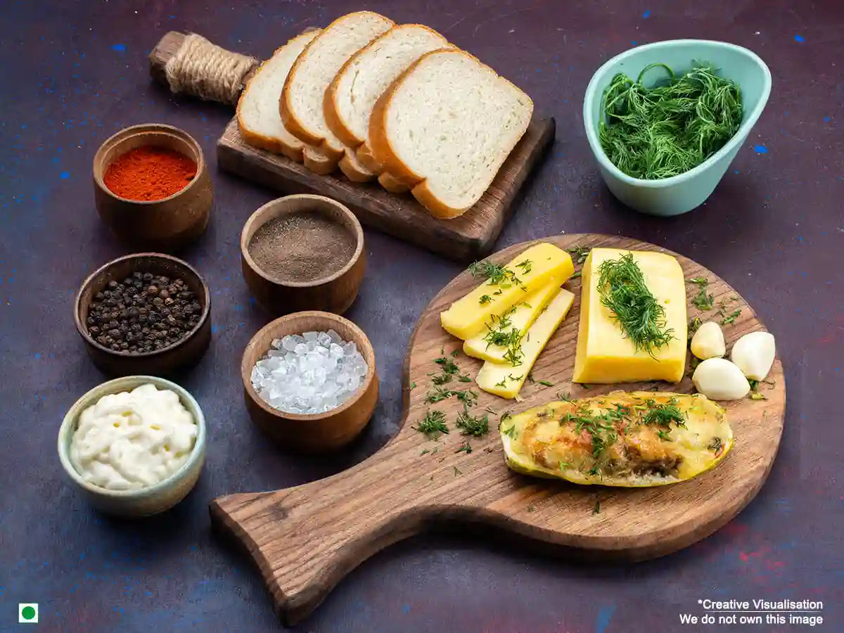 An image showing a spread of all ingredients required to make a chilli cheese toast.