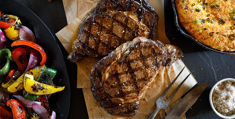 ribeye steaks with grilled peppers