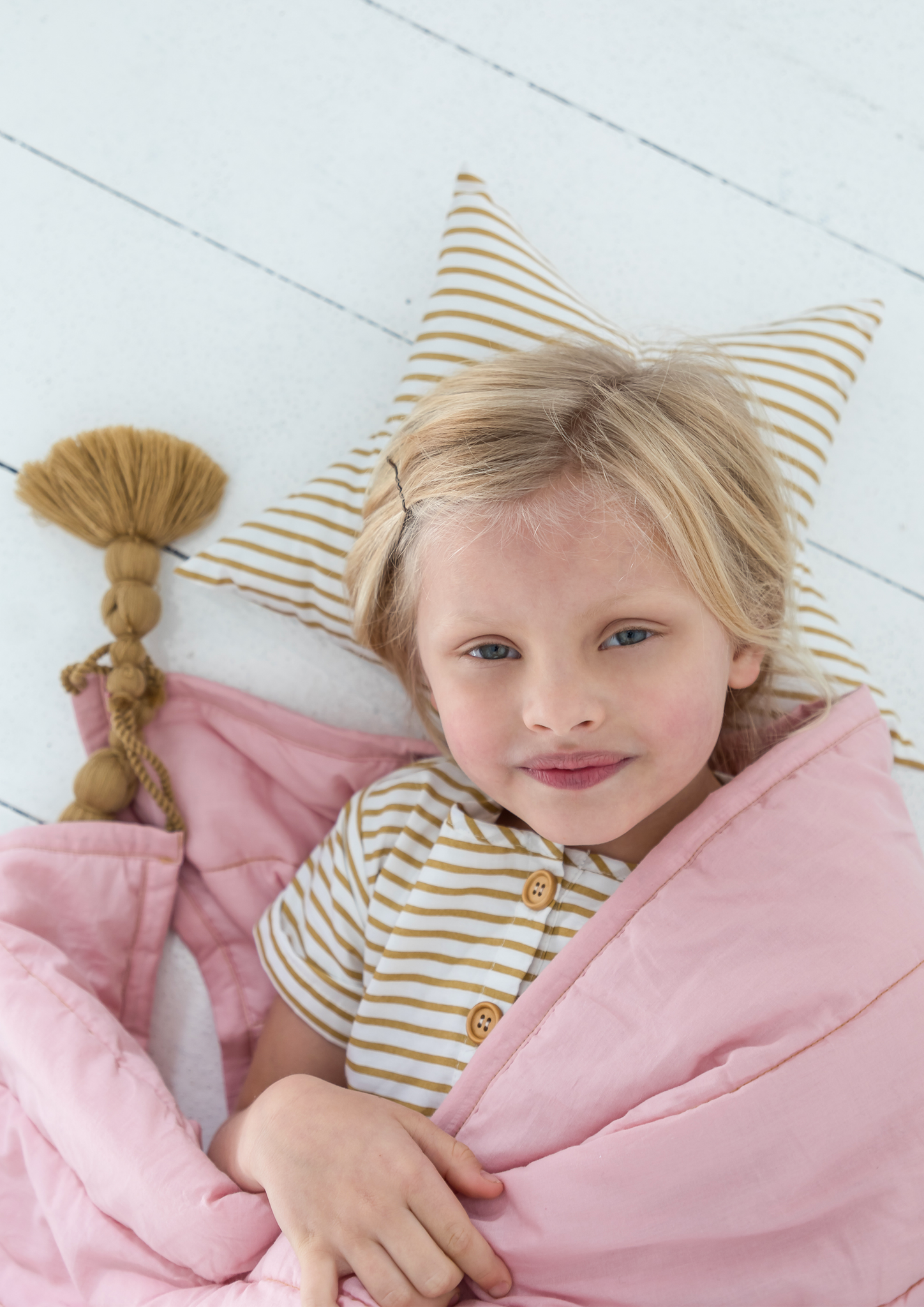 pink with mustard tassel quilt