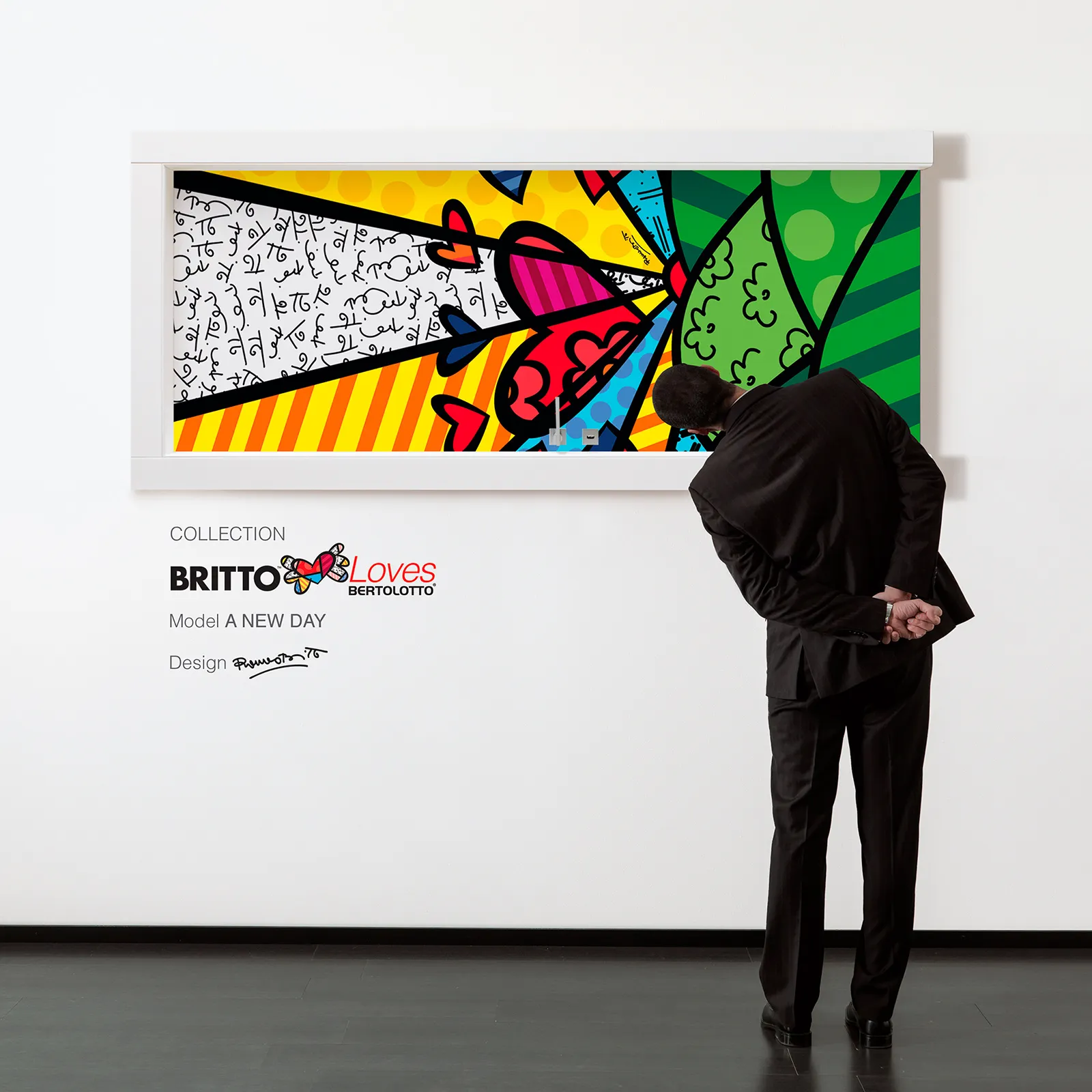 A man curiously looking at a Romero Britto Art work in Spacio Art Gallery. Spacio Blog on Romero Britto.