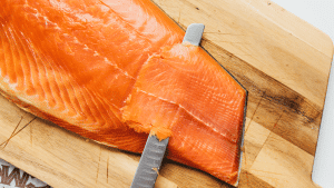 Slicing smoked salmon