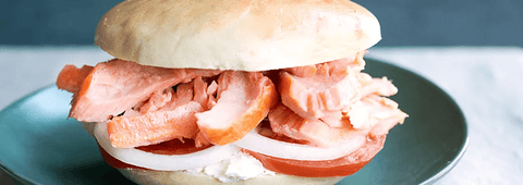 Hot smoked salmon and cream cheese bagel