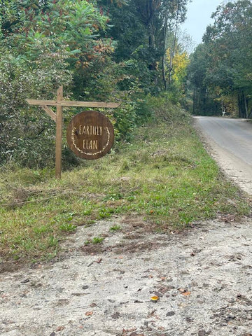 Earthly Elan sign on dirt road
