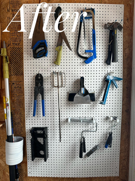 Sorted tools on a white pegboard