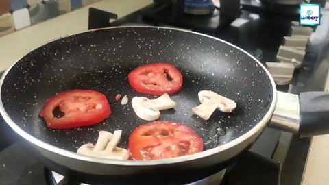 Add tomato slices and mushroom slices.