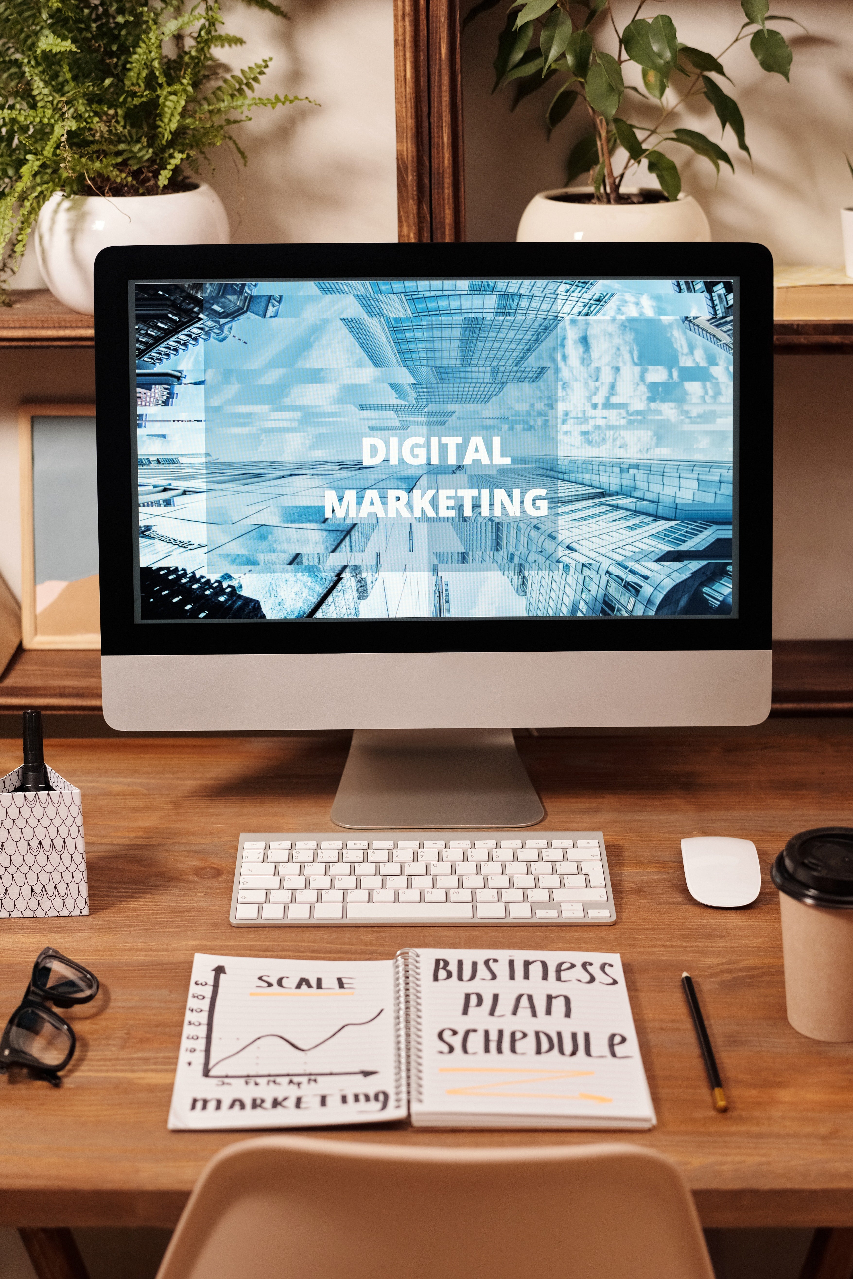 digital marketing image with apple imac computer and online digital marketing graphic on the screen 