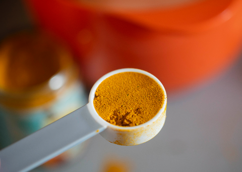 GOLDEN MILK BEING PUT IN DRY INGREDIENTS 