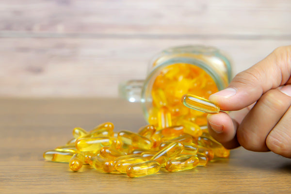 Omega-3 pills spilled out of a bottle