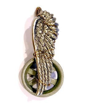 wire wrapped wing and wheel pendant