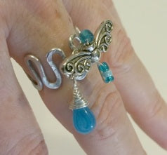 whimsical ring with dangle