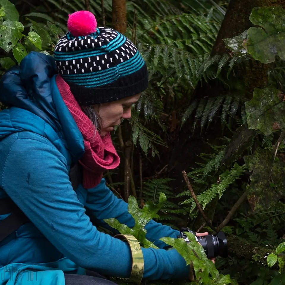 Hayley taking a photo of fungi