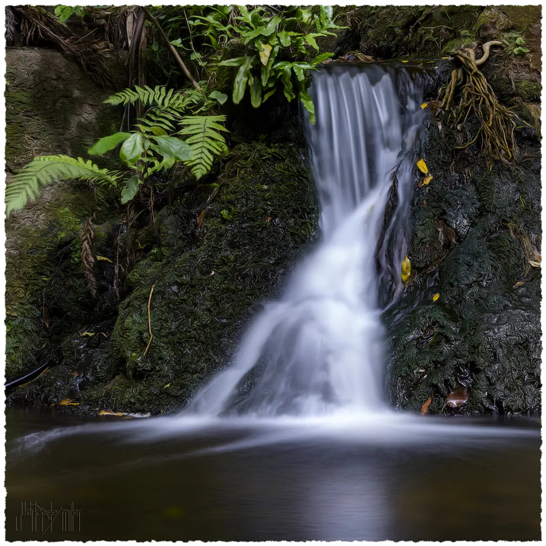Photo of a small waterfall taken with a slow shutter speed