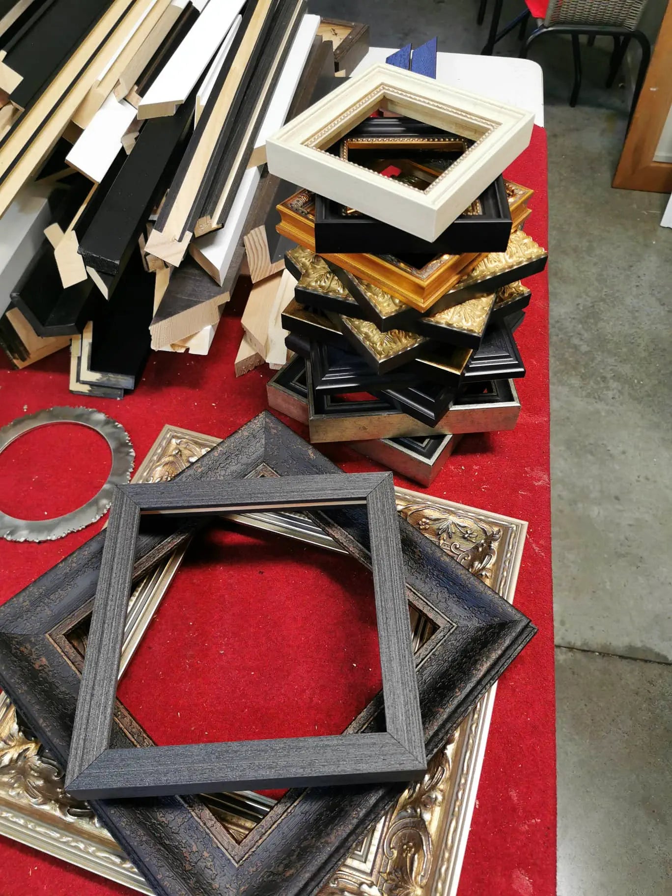 Frames piled on a table