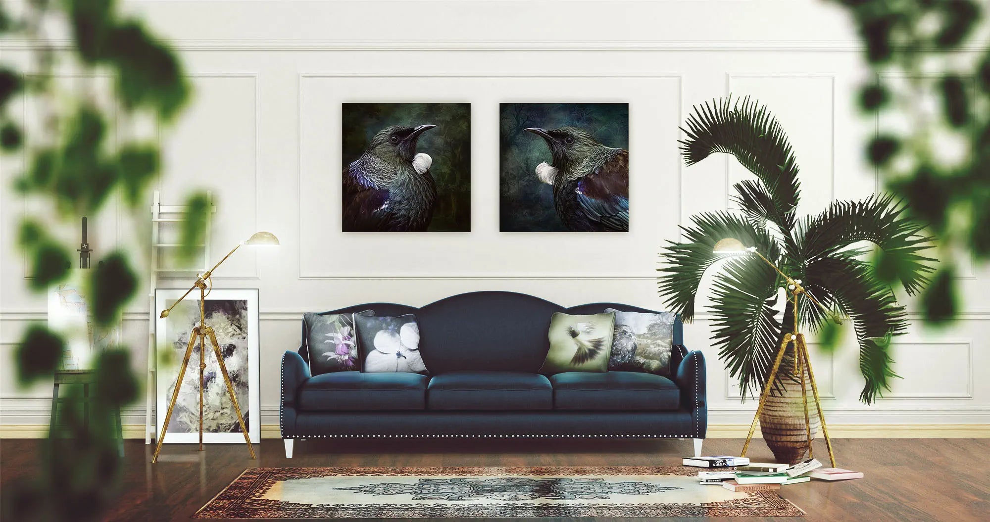 Two artworks hanging in a lounge above a sofa