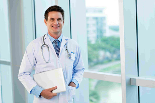 happy-doctor-standing-with-a-laptop-SBI-325536810.jpg__PID:2407ab1e-48ef-4aeb-a3a0-0cb437bf6259