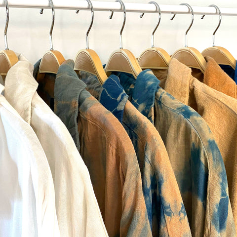 Here's a rack of clothing I dyed. Each piece is made from organic fabric and natural dyes.