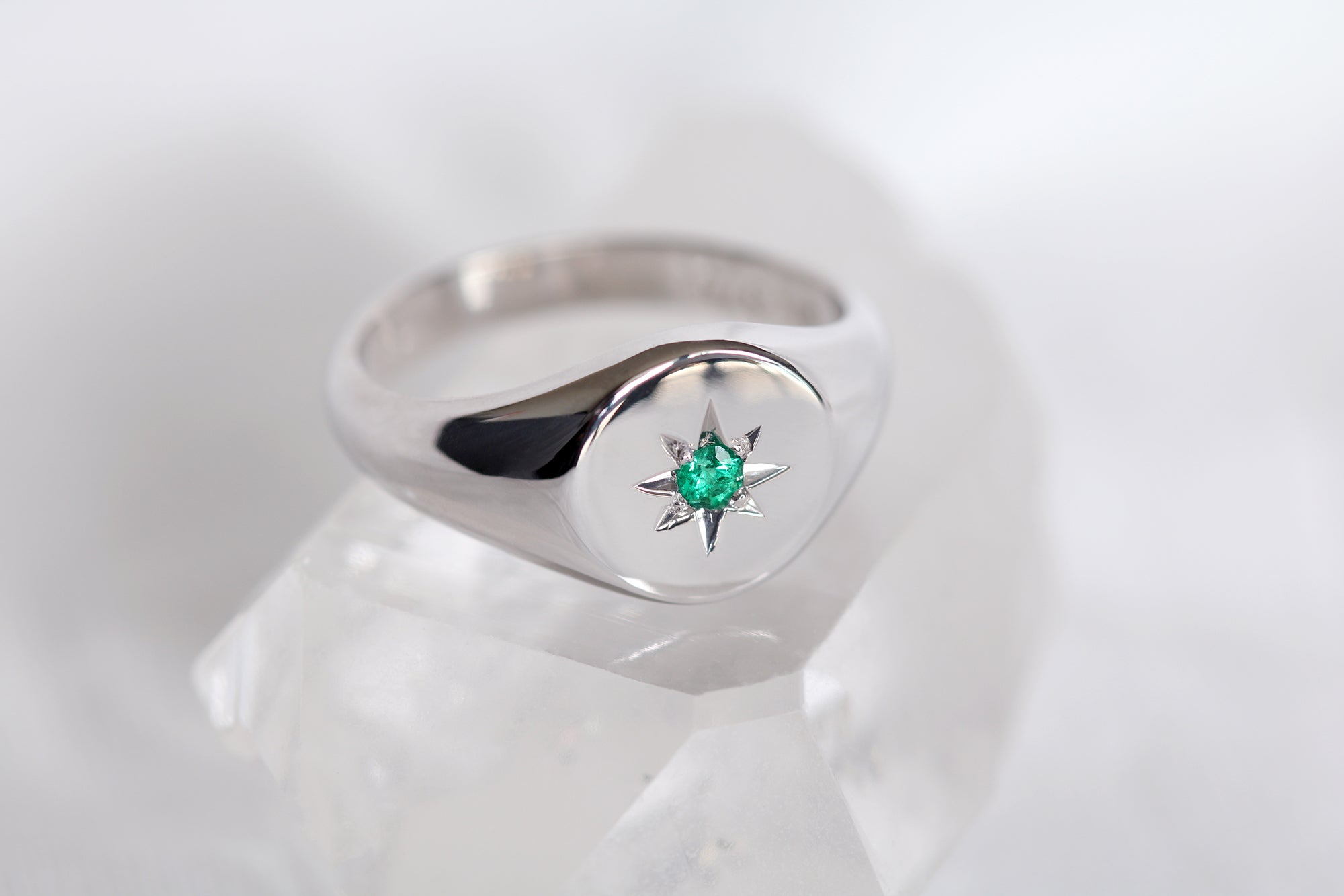 white gold signet ring with star set emerald