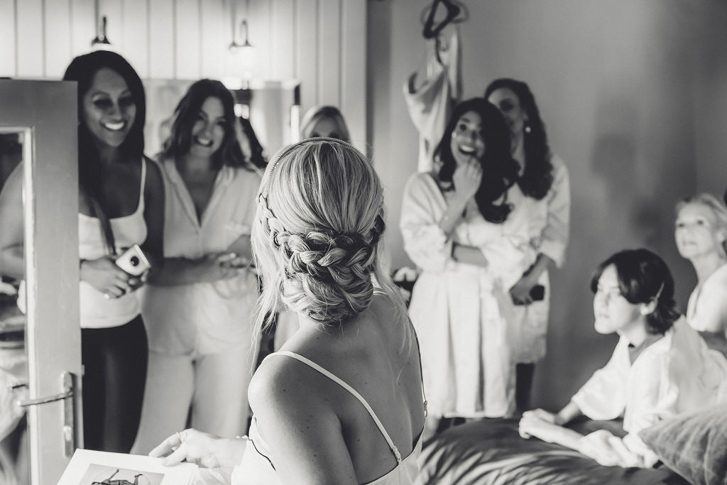 Bride with bridesmaids getting ready at Trevenna Barns