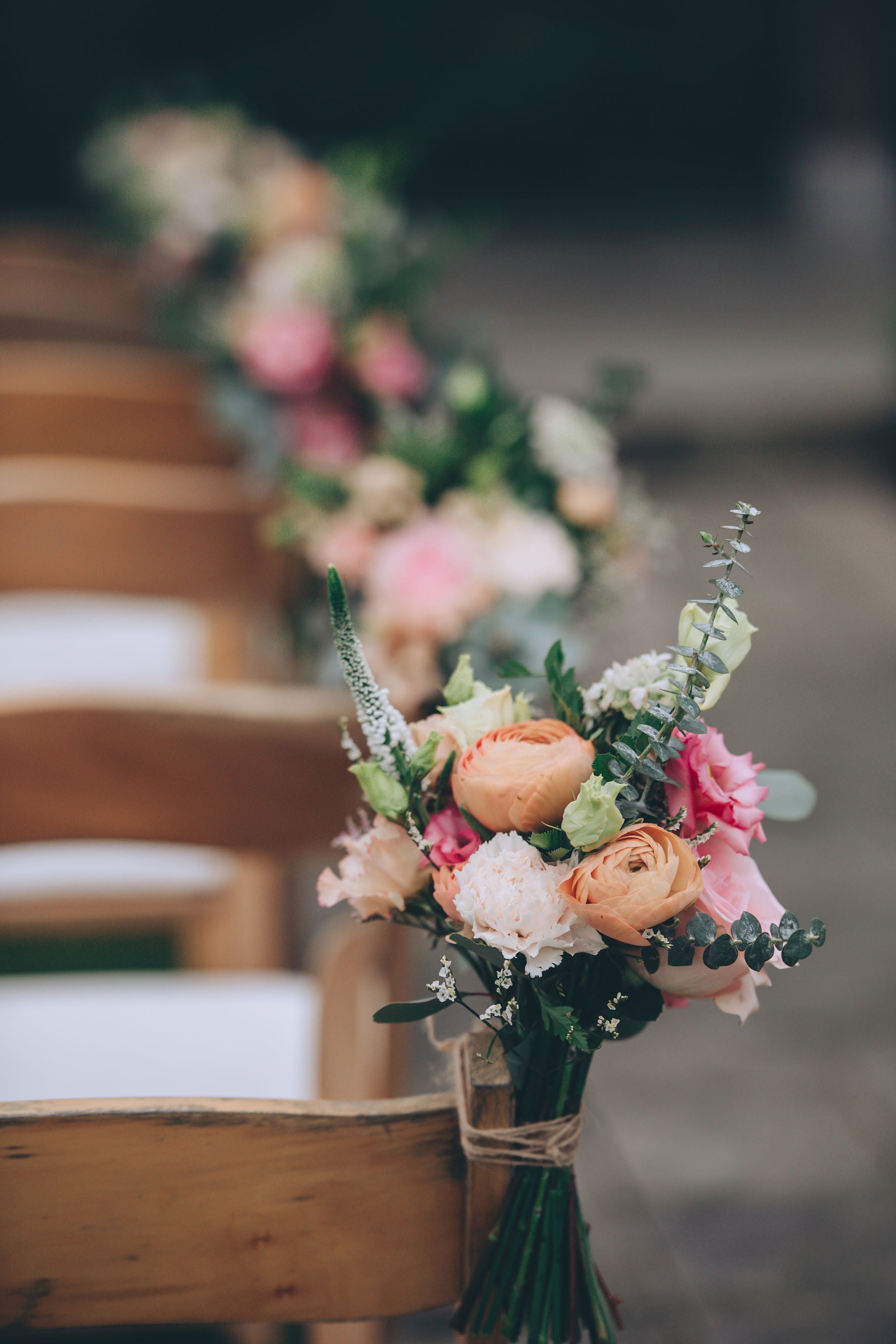 Ceremony chairs with floral ties at Trevenna wedding barns