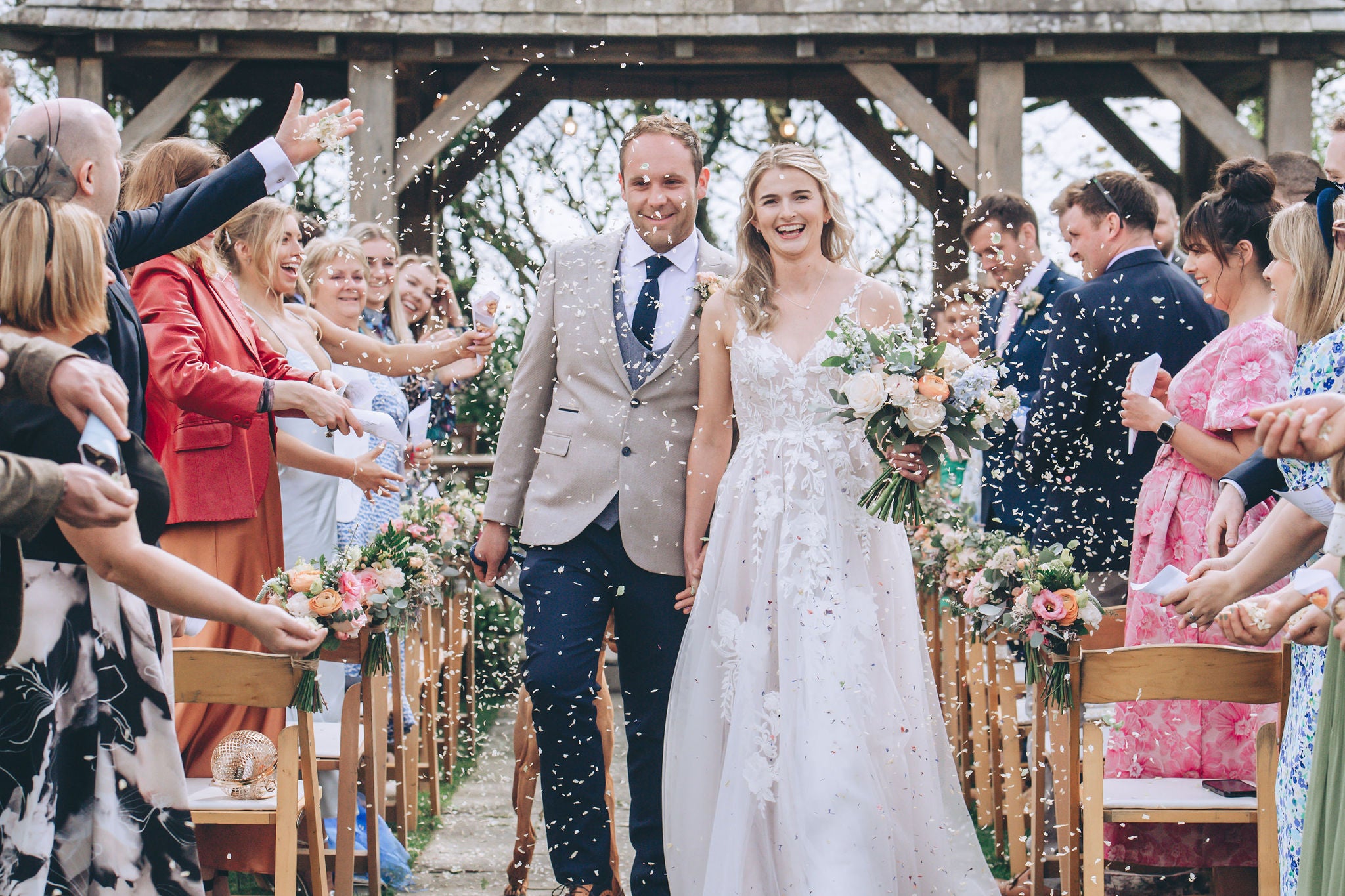 Confetti bring thrown over wedding couple at Trevenna barns