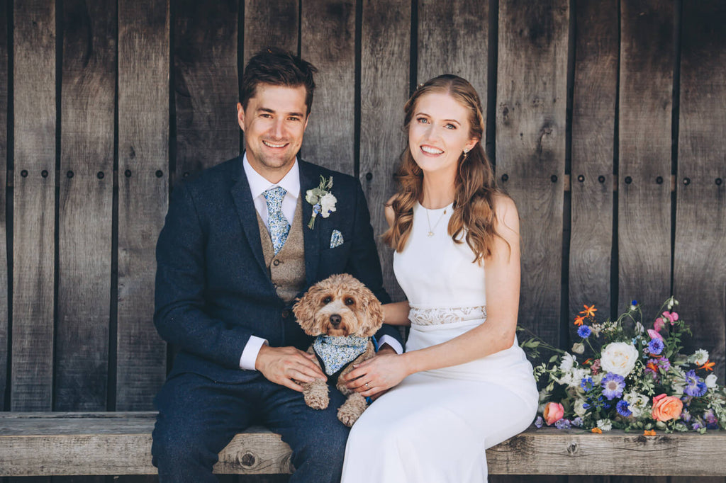 Dog with bride and groom at wedding