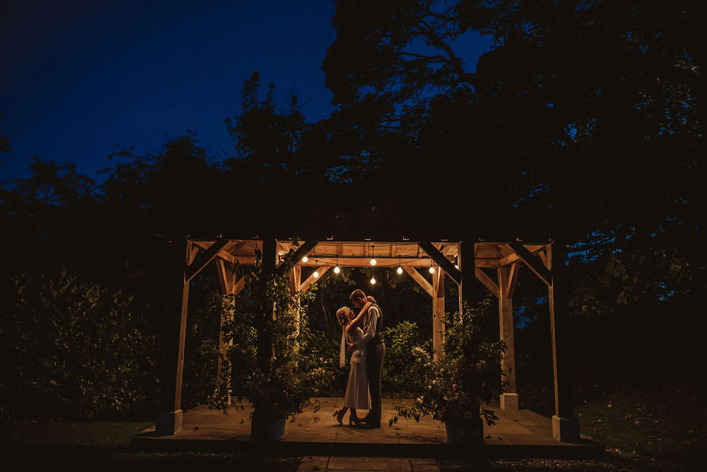 Couple under Arbour at night Trevenna barns