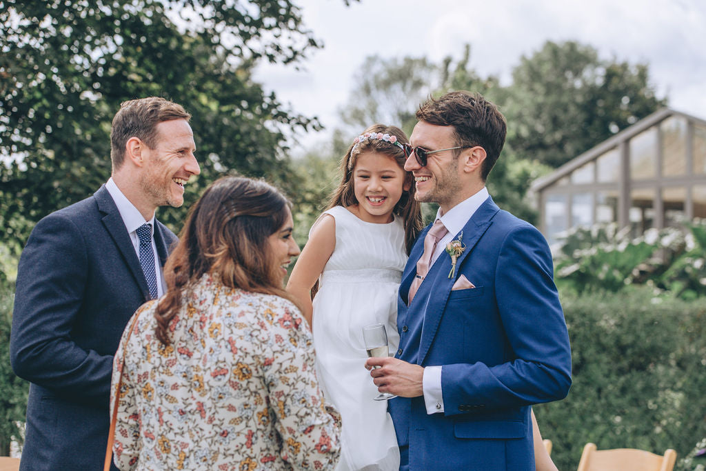 Wedding guests on lawn at Trevenna barns