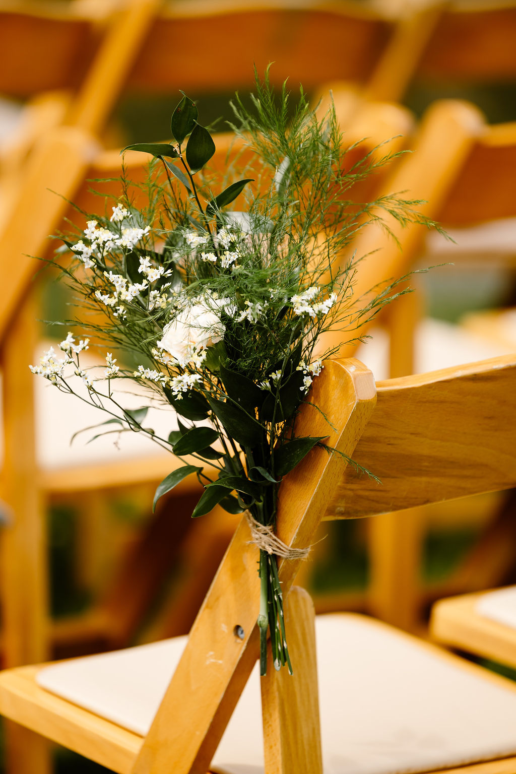 Ceremony chair decorated with floral detail at Trevenna barns
