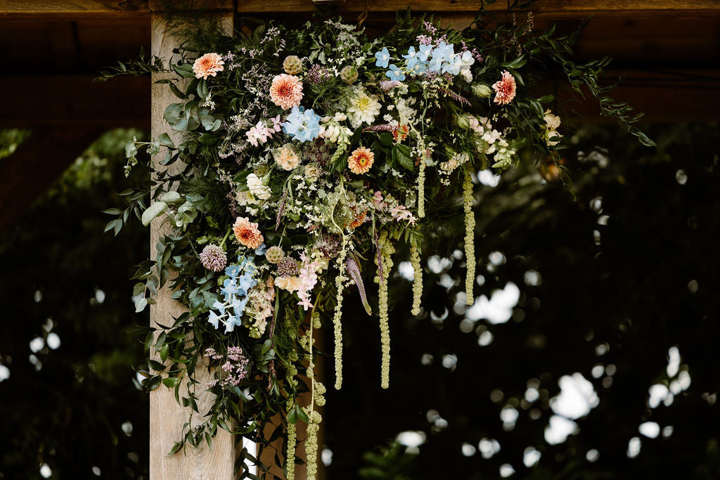 Flower install over Arbour at Trevenna wedding barns