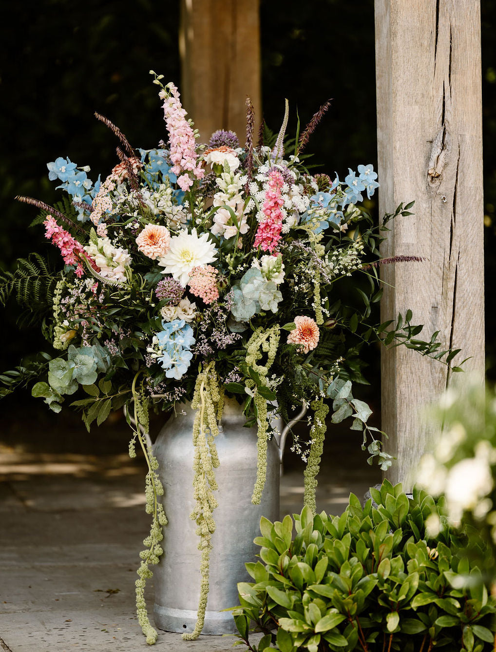 Milk churn of wedding flowers at Trevenna barns